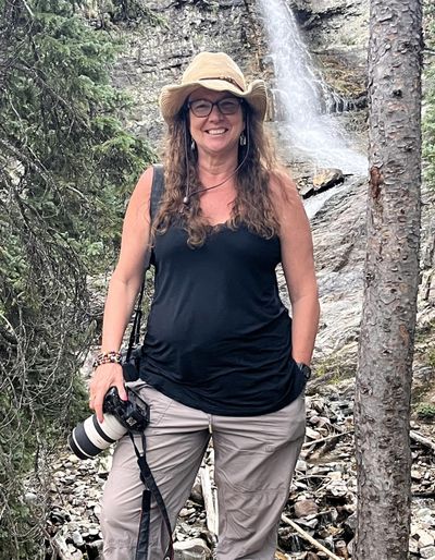 Beth Staub holding a camera