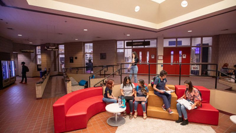 Students sitting on couches at the Yuma campus library.