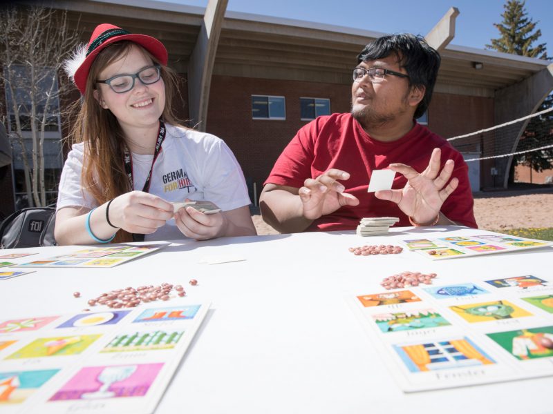 Students play board games outside.