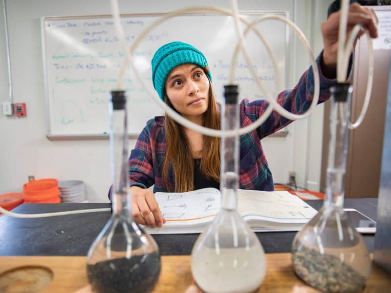 Environmental engineering student studying in a lab.