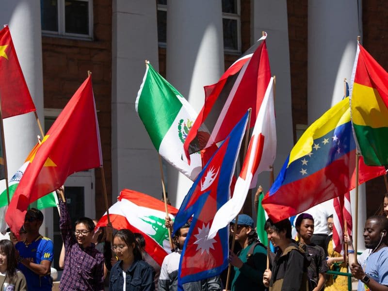 Several international flags held up in the air