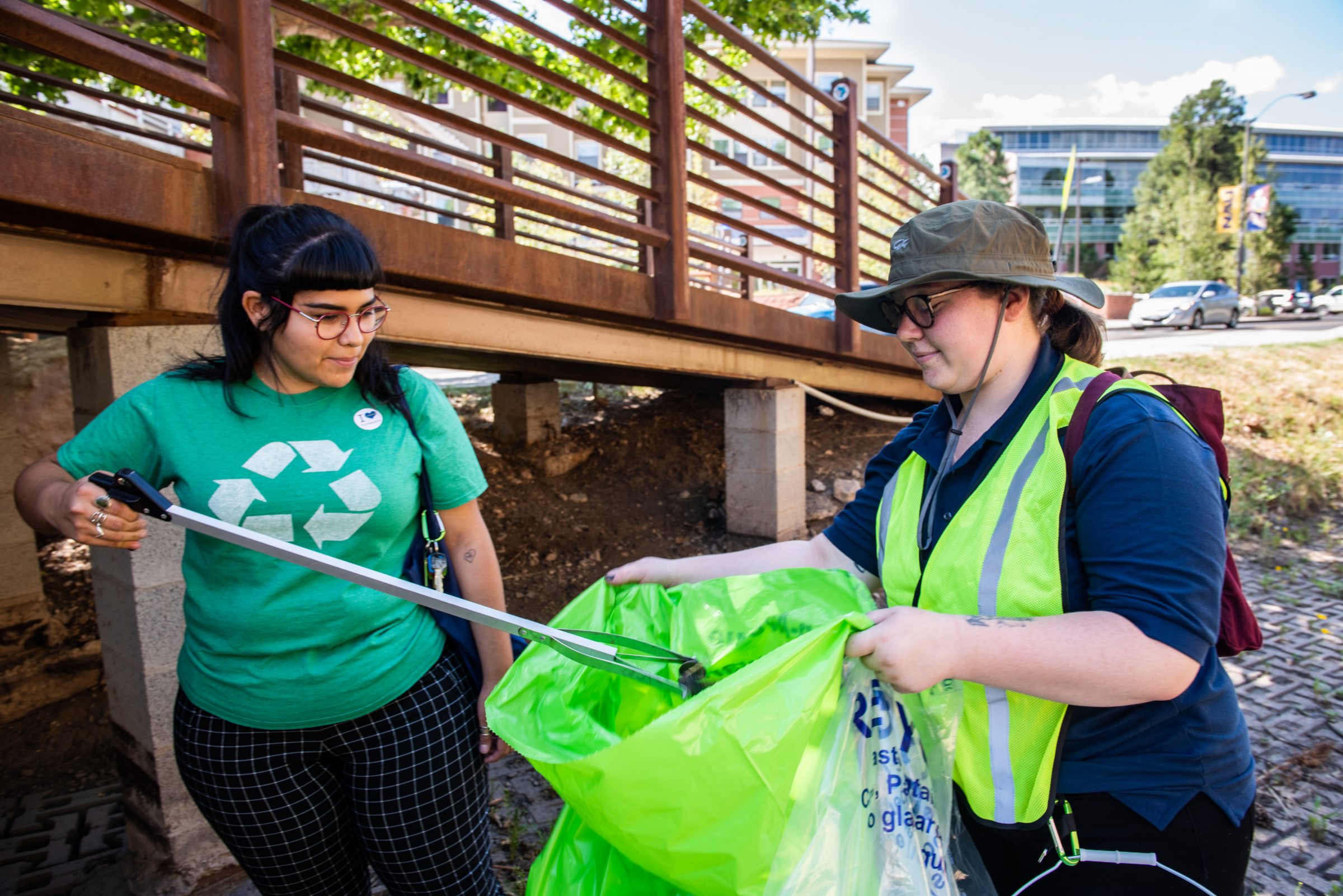 NAU community members volunteering to clean up trash during an "Axe the Trash" event.