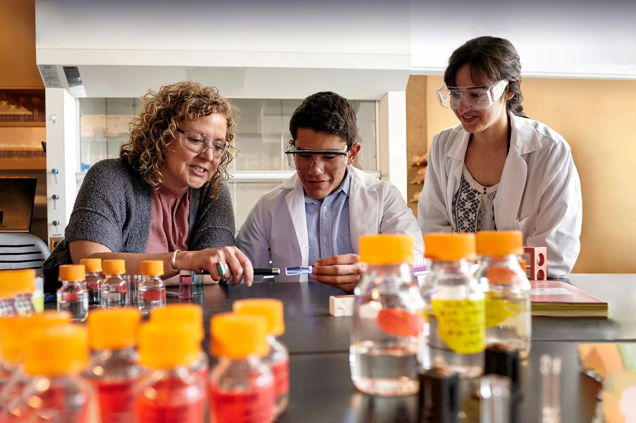 Jennifer Martinez, PhD, Professor and Director, Center for Materials Interfaces in Research and Applications, working with NAU students in a lab.