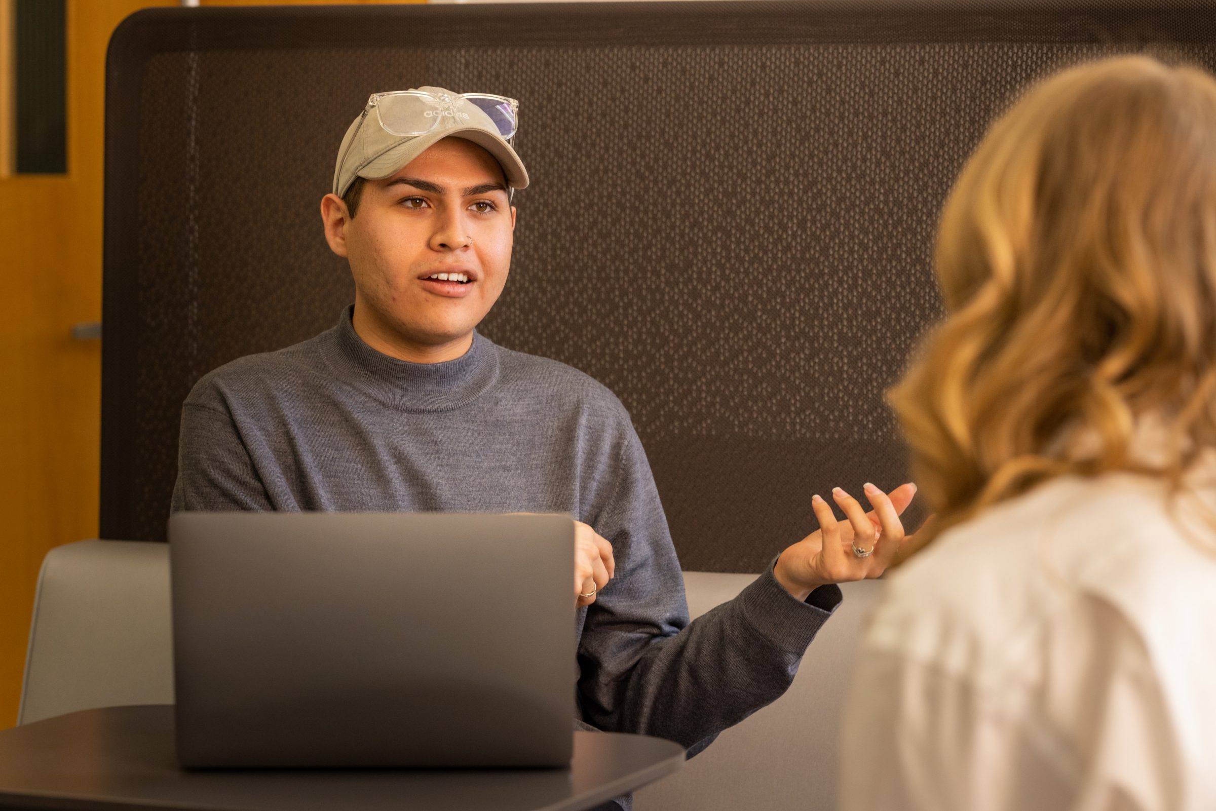First-generation Biomedical Science major Andres Huerta talks with a fellow student.