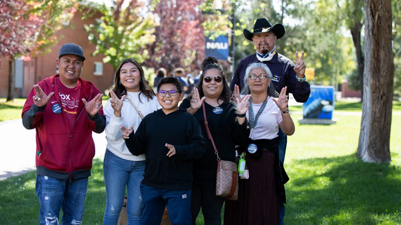 Family with NAU student enjoying family weekend on campus