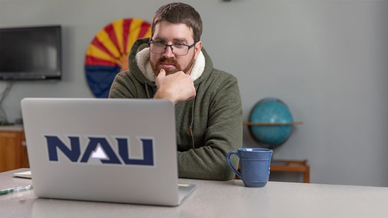 An N A U student sits at the computer completing their FAFSA application.