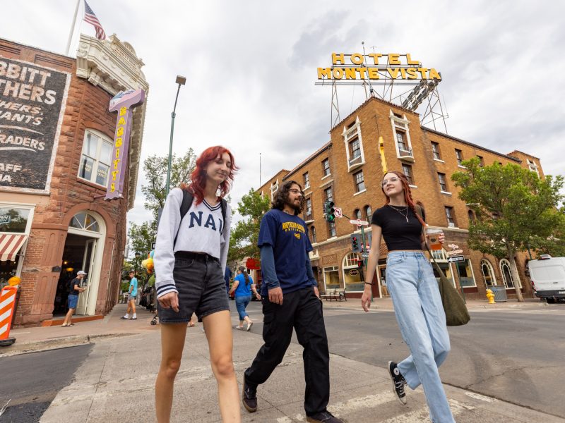 Three students walking in Downtown Flagstaff, Arizona.