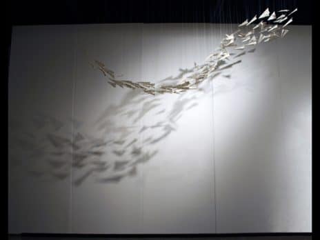Hanging sculpture of paper airplanes by Professor Jennifer Holt