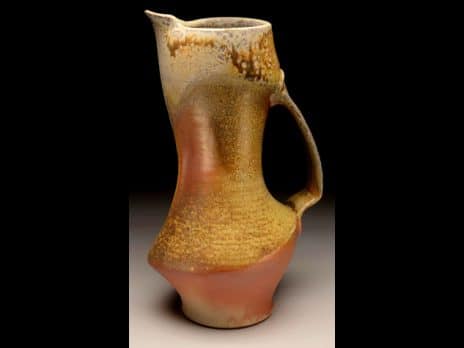 Orange clay pitcher by student Coleton Lunt
