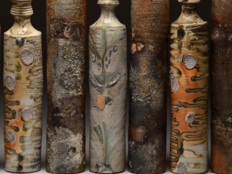Close up of ceramic bottles sculpted by Professor Jason Hess
