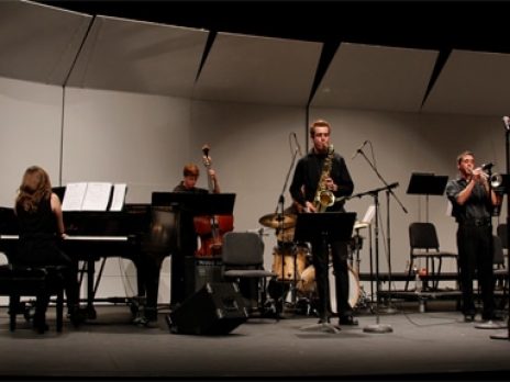 Jazz group performing on stage.