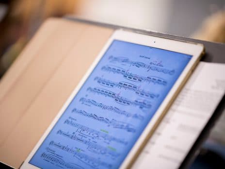 Close up of iPad with sheet of music on screen.