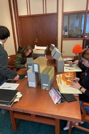 A group of students examining archival sources