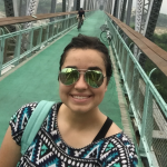 NAU student on a bridge in China.