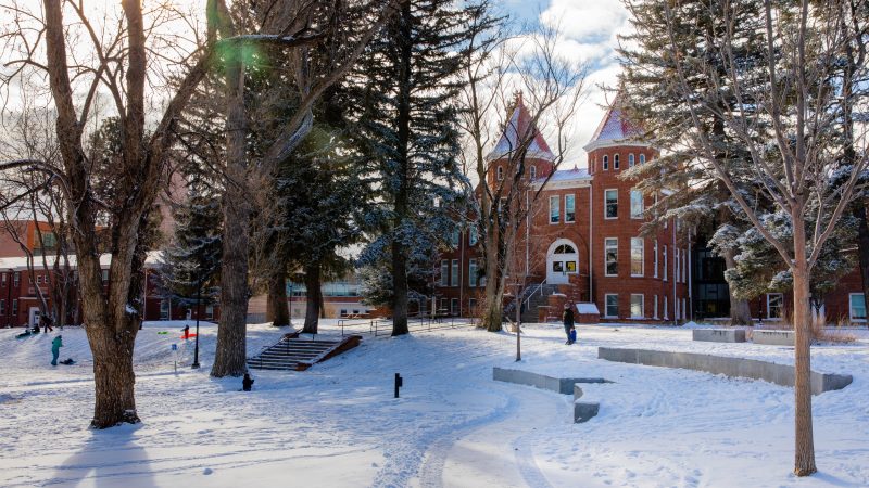 A snow covered north quad and old main at N A U's Flagstaff campus.