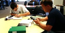 NAU student using a calculator in a study session