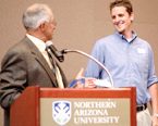 NAU student being awarded by a faculty member