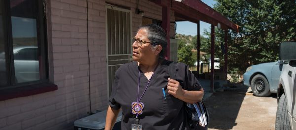 An image of a community health worker dressed in scrubs