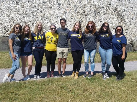 Photos of students in the study abroad program, along with Dr. Palamaro-Munsell, at Newgrange.