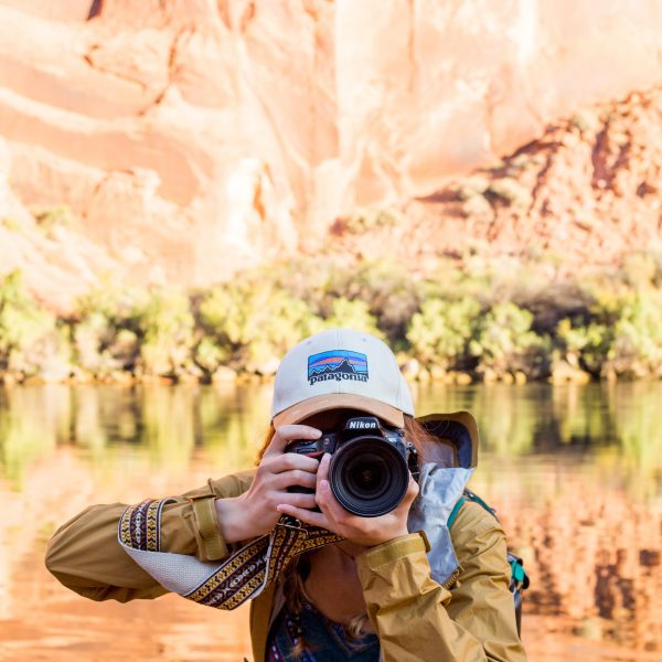 Student taking a picture at Glen Canyon.