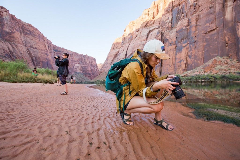 Claire Sipos with a camera on an NAU photography trip.