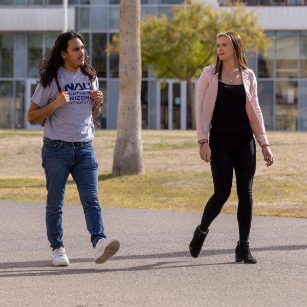 Kacey Cordell and two other students walk across NAU–Yuma campus.