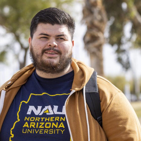 Bryan Vazquez talking with another student on the campus of NAU–Yuma.