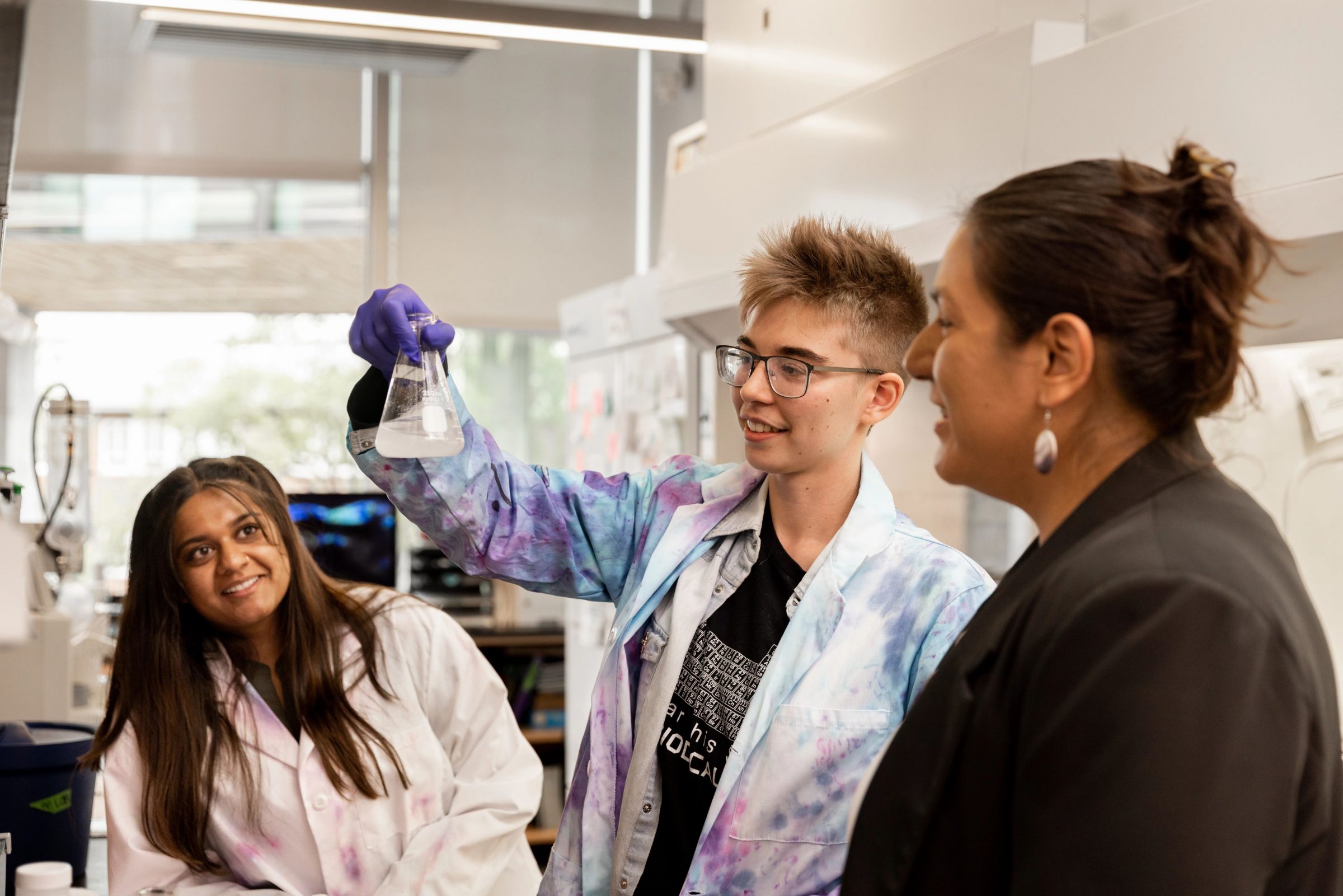 Professor Naomi Lee mentors two students as they conduct research in her lab.