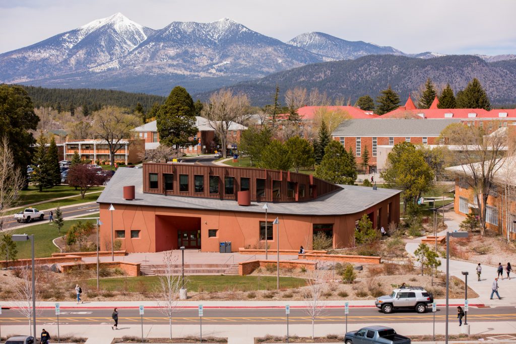 NAU's Native American Cultural Center with the sacred mountain, Dook'o'ooslííd—the San Francisco Peaks—in the background.