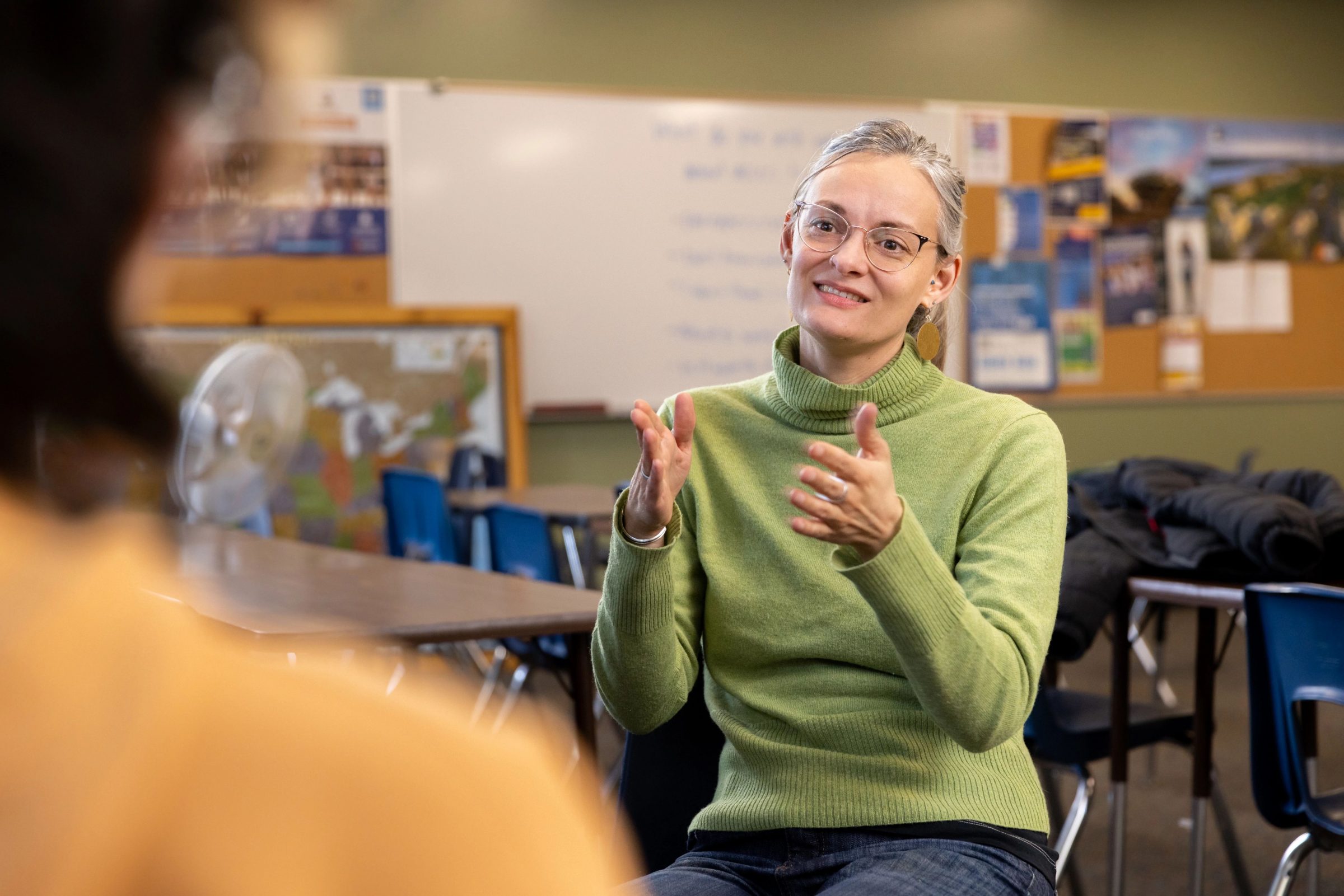 Associate Teaching Professor Nora Timmerman talks with CUPI participant in a Flagstaff High School classroom.