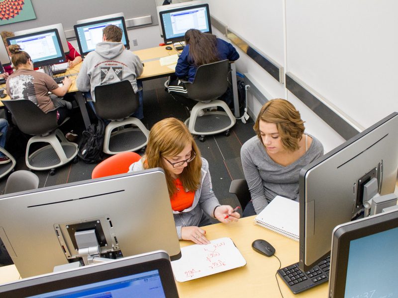 NAU students working on computers.