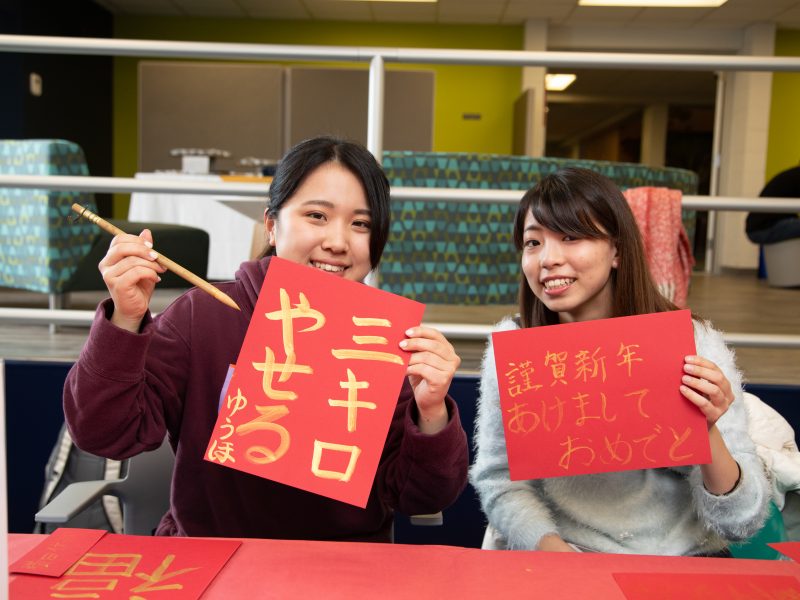 NAU students with Chinese callligraphy