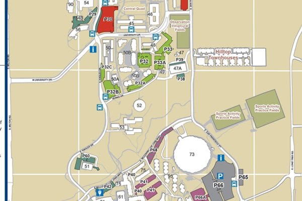 An overhead map of N A U from south Milton road in the west to Lone Tree road in the east and west University drive in the north to east Pine Knoll drive in the south. Buildings are white with the building number, parking lots are dark gray, and fields are gray green. The overall map is light brown with parking lots and shuttle stops denoted with blue squares containing either a P or a bus picture.