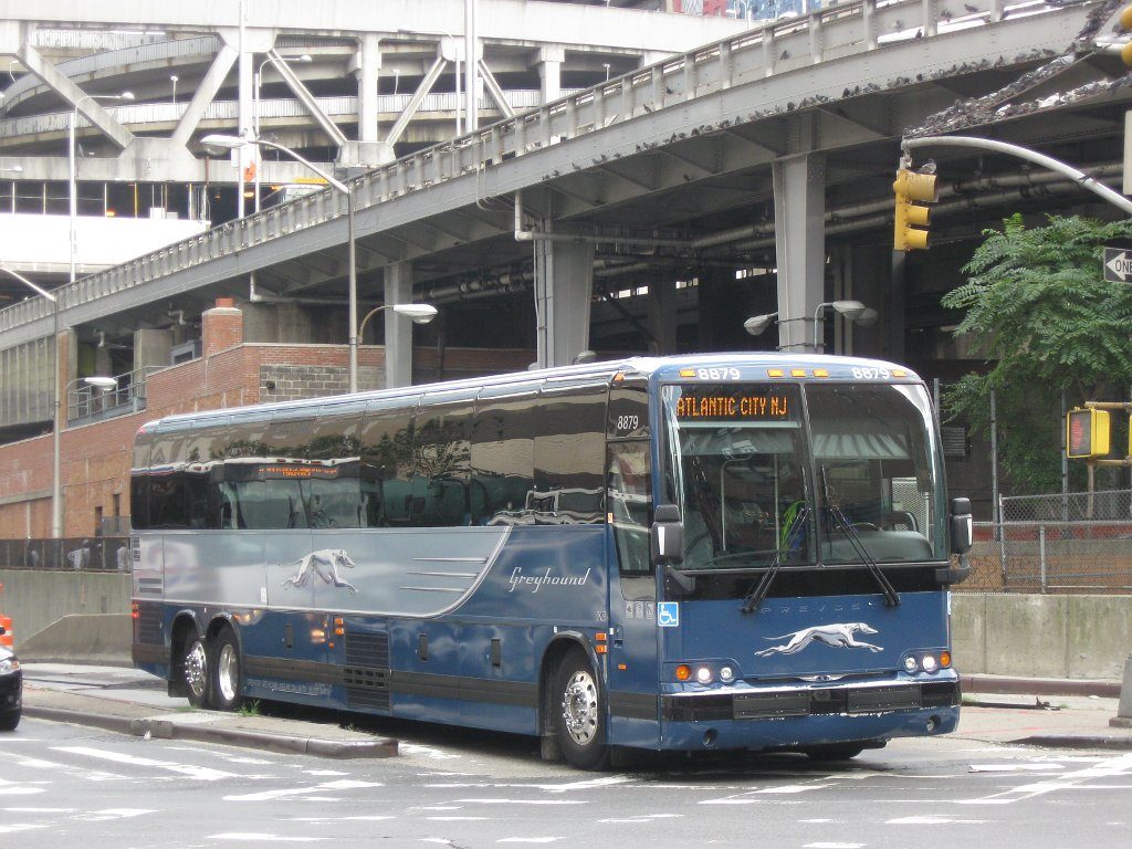 Greyhound bus passing through an intersection