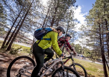 nau-students-riding-bikes-on-trail