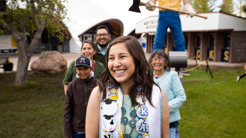 Native American student celebrating commencement