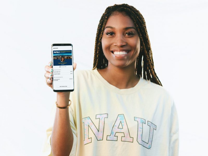 Student holds up an Android phone