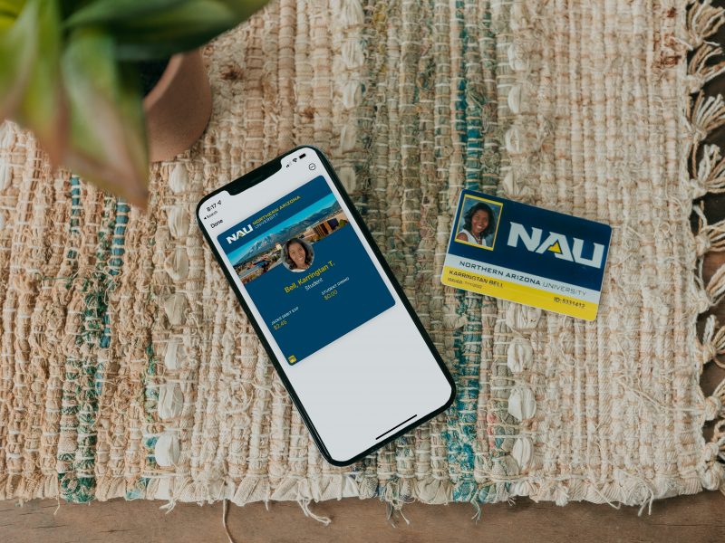 An Apple phone and NAU ID card