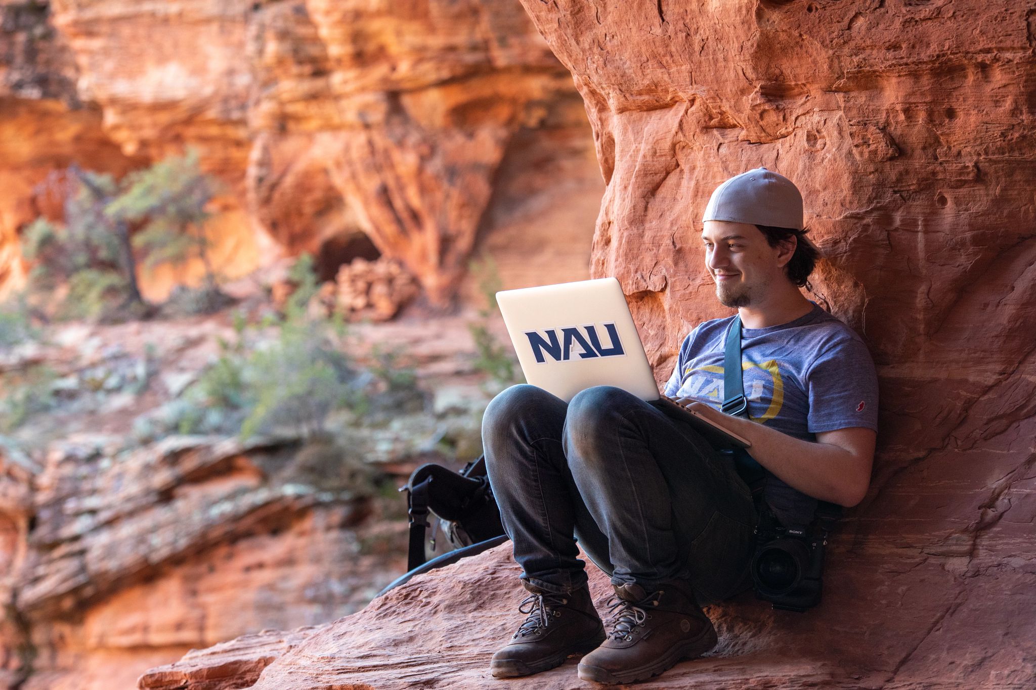 Student works on a laptop outside in Sedona