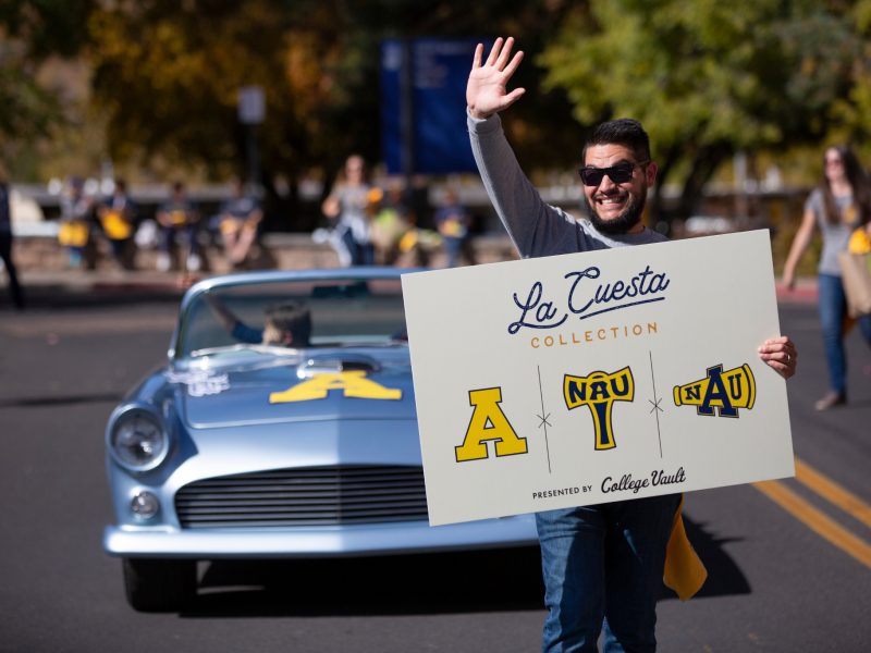 The La Cuesta Collection by College Vault is displayed during the N A U homecoming parade.