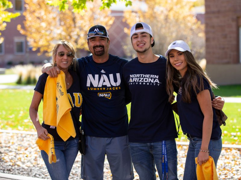 A family poses with their N A U gear.