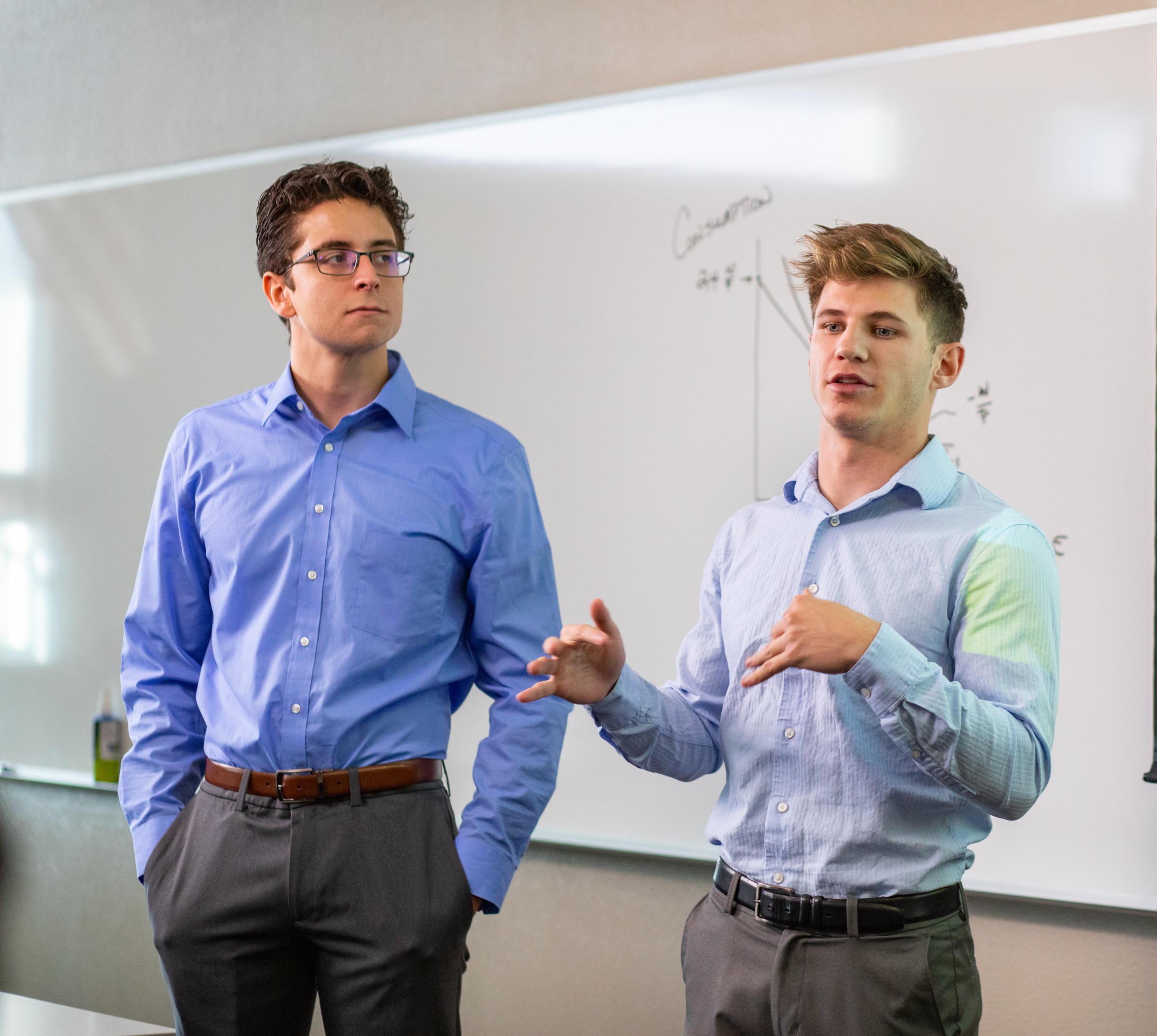 Students leading a presentation in a business class.
