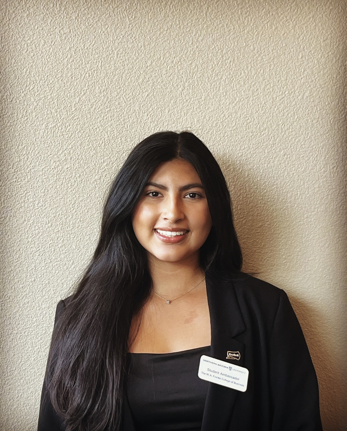 Northern Arizona University junior, Tracy Castillo, smiles and poses for a portrait