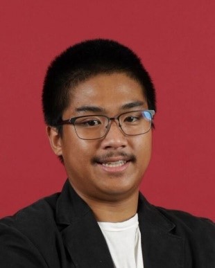 Jacob-Dylan Reyes, a sophomore economics student at Northern Arizona University, smiles for a portrait.
