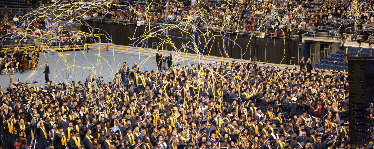 NAU students celebrate at graduation.