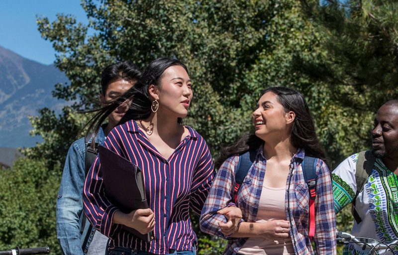 Students walking outside on campus.