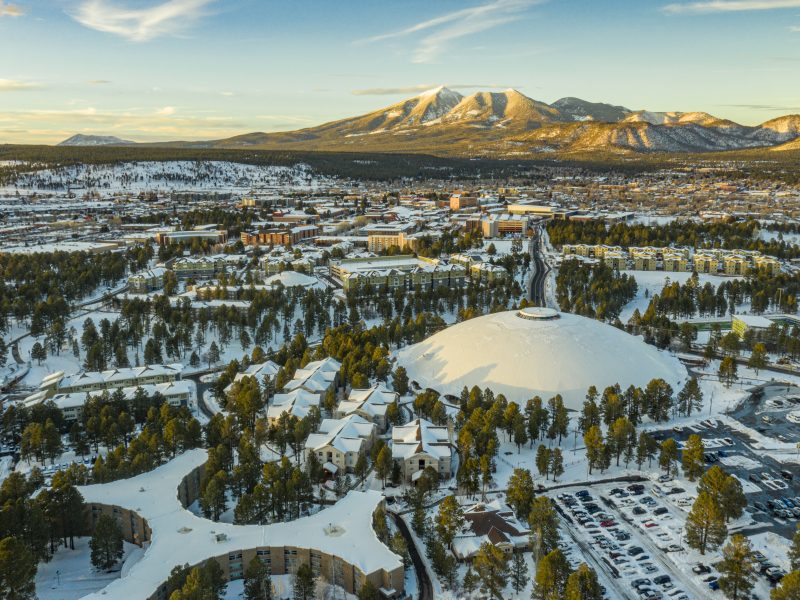 A drone shot of NAU covered in snow.