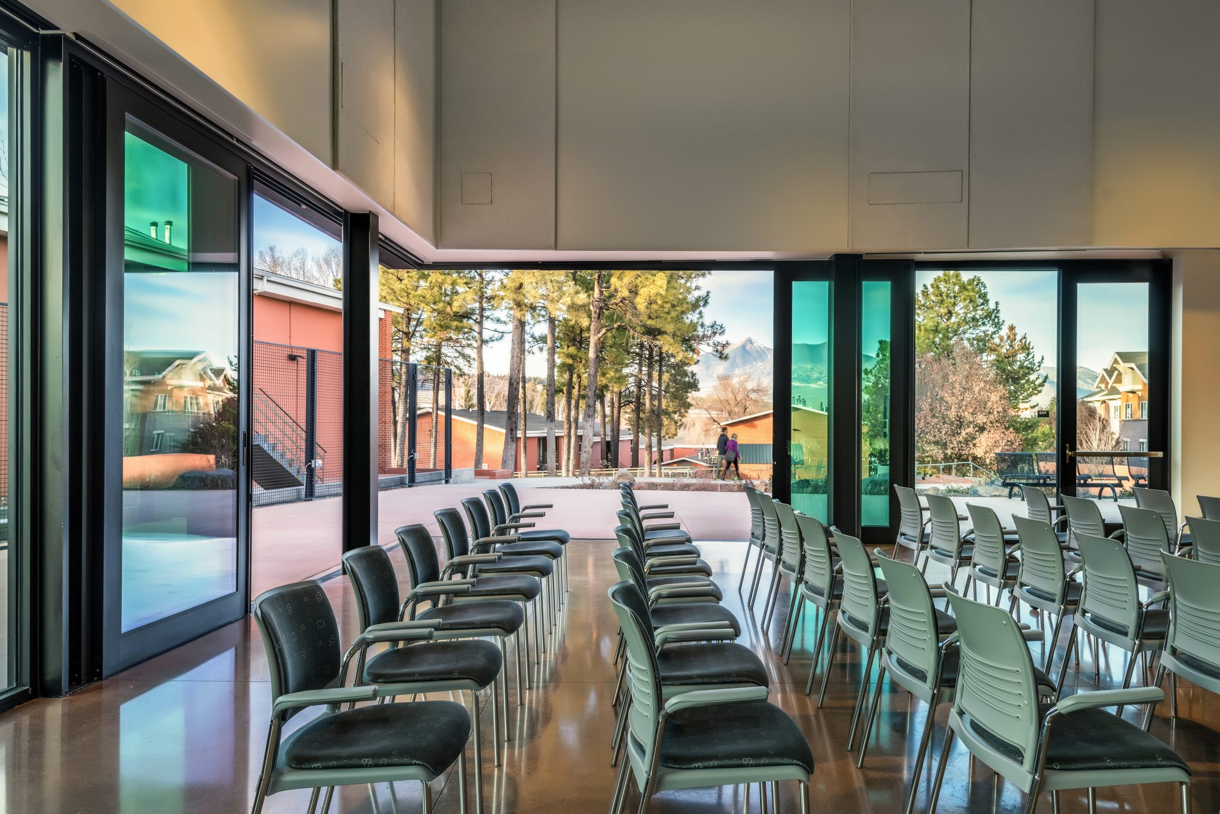 Large folding doors at the NAU International Pavilion, offering a seamless transition between indoor and outdoor spaces for a hybrid event experience.