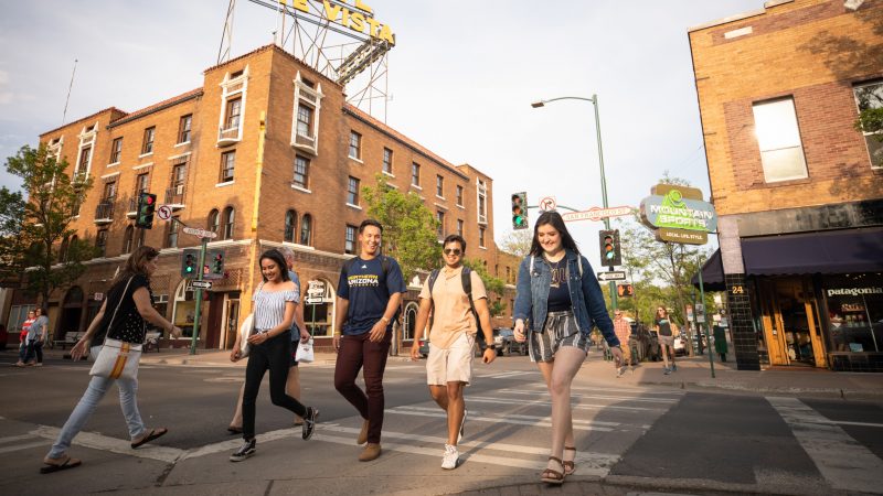 Students crossing a crosswalk in downtown Flagstaff.