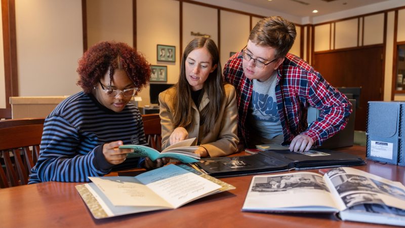 Students and instructor viewing documents in CLine Special Collections